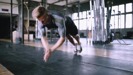 Strong athlete practicing for wellness, workout, fitness, muscular body and healthy life. Caucasian people and sports. Explosive push ups exercise. Adult male athlete doing push ups with a clap in a