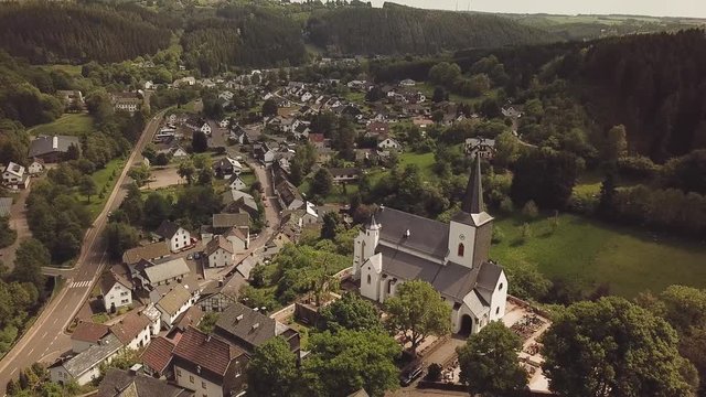 St. Matthias Church on a hill in Reifferscheid Germany Aerial 