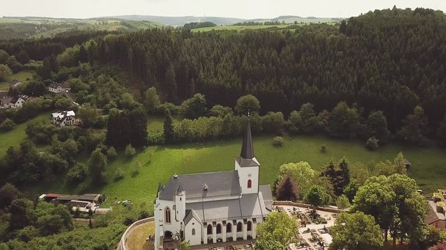 St. Matthias Church on a hill in Reifferscheid Germany Aerial 