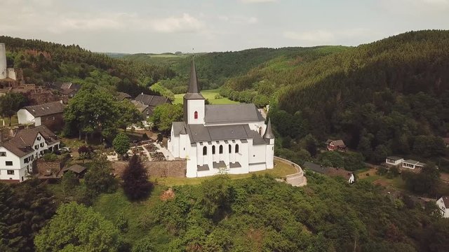 St. Matthias Church on a hill in Reifferscheid Germany Aerial 