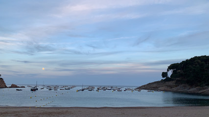 A beautiful blue sky with the sea full of boats
