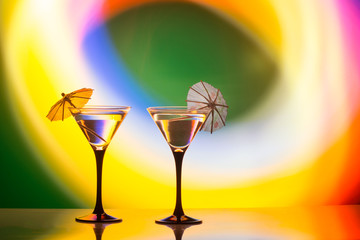 colourful cocktail on the club light background.