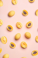 Apricots on a colored background. Pattern of a apricots. Apricots isolated, flat lay, top view