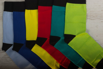 Textile colorful socks background. Green, pink, red, blue, yellow and other colors