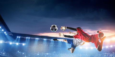 Soccer player on stadium in action. Mixed media