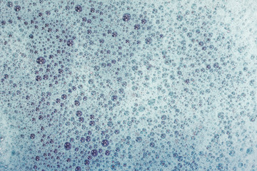 Soap bubbles background- suds liquid