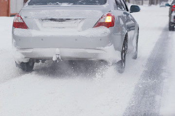 Cars with winter tires on snow-covered road