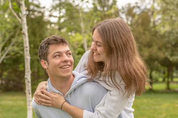 Fototapeta premium Christian friendship. Two happy friends laughing and hugging outdoors.