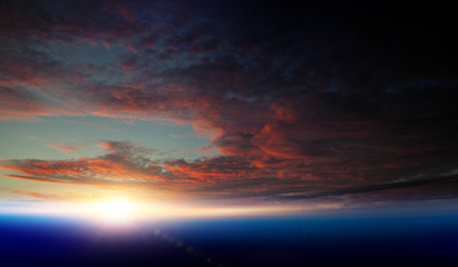 Fototapeta premium Earth with sunrise on blue space background