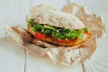 fried fish Sandwich with lettuce, tomato with tartar sauce. author's recipe street food