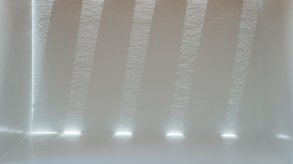 The beam and shadow on the background inside the gray room with