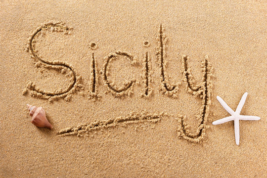 Sicily word written in sand sign writing drawing drawn on a sunny sicilian summer beach with starfish holiday vacation travel destination message photo