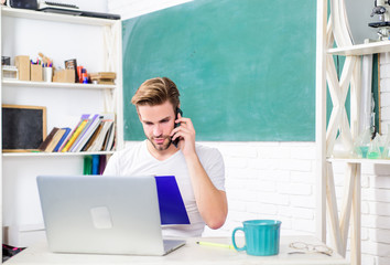 need help. modern education. college life. school teacher use computer and phone. man make note and drink coffee. back to school. Working day morning. student man in classroom with tea cup