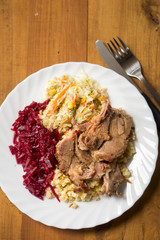 Pork shoulder with mashed potatoes and beetroots