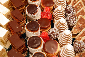 Colorful desserts and pastry served on a wedding party