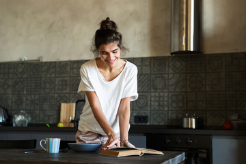 Attractive young woman having healthy breakfast