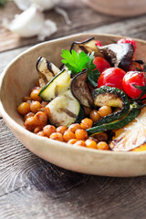Healthy vegan bowl with grilled vegetables, and roasted chickpeas
