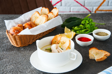 Creamy vegetable soup with chicken and croutons