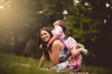 Fototapeta premium This is fun. Mother and daughter in nature.