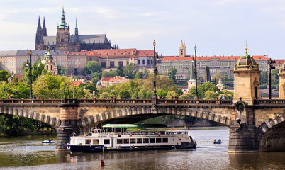 Fototapeta premium Prague, Czech Republic skyline with historic Charles Bridge. Boat cruise on Vltava river