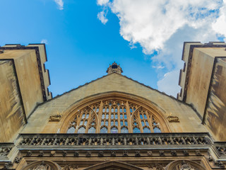 View of the Westminster Palace and the Houses of Parliament building facade against the blue sky, London, UK.