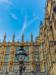 Fototapeta premium View of the Westminster Palace and the Houses of Parliament building facade against the blue sky, London, UK.