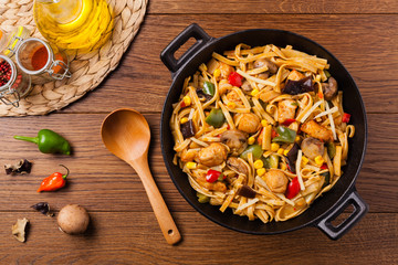 Indonesian pasta with chicken, pieces of bamboo and mushrooms.