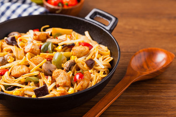Indonesian pasta with chicken, pieces of bamboo and mushrooms.