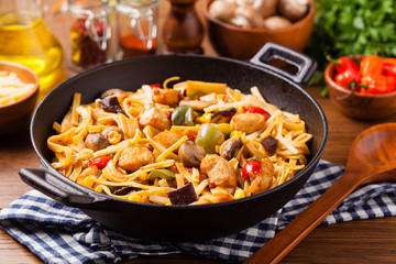 Indonesian pasta with chicken, pieces of bamboo and mushrooms.