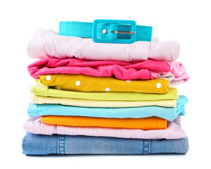 Stack of folded colorful clothes for children and teens.