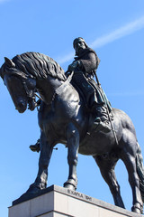 Fototapeta na wymiar National memorial on Vitkov hill, Zizkov, Prague, Czech Republic / Czechia - Equestrian statue of Jan Zizka, legend and famous hero. Bronze sculpture of rider and horse on pedestal