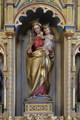 Obraz premium Virgin Mary with baby Jesus statue on altar of Our Lady in the church of Saint Matthew in Stitar, Croatia 
