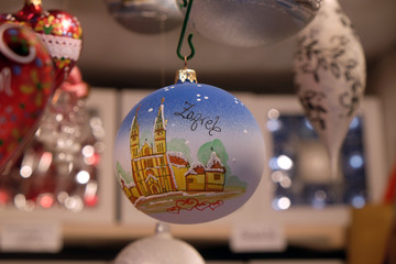 Stall with decorations for winter holidays at traditional annual Christmas market in Zagreb,...
