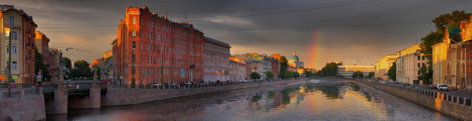 Rainbow over the Fontanka river embankment in St. Petersburg