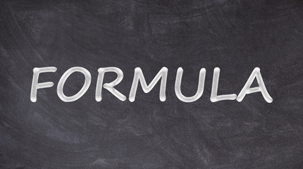 Obraz premium Formula text written on blackboard