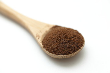 wooden spoon with coffe powder