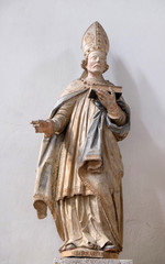 Obraz premium Saint Burchard of Wurzburg, statue in Neumunster Collegiate Church in Wurzburg, Germany
