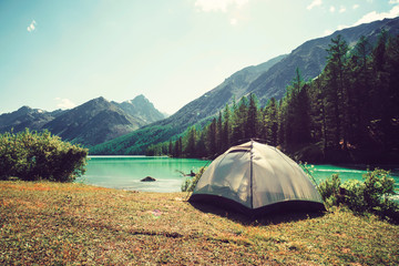 Camping tent with lake background. rest or vacation in the wild in Siberia in Altai. outdoor...