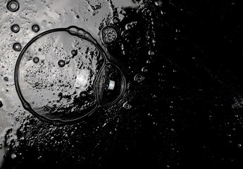 Soap foam with shiny bubbles isolated on black, with clipping path, texture and background, top view