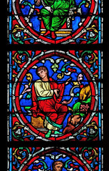 Colorful stained glass window in the Notre Dame Cathedral, UNESCO World Heritage Site in Paris, France 