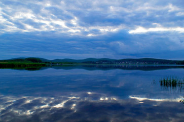Fototapeta premium Reflection of the evening sky in the water. River Iset. Sverdlovsk region, Russia 
