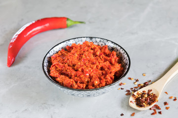 Traditional Maghrebi hot chili pepper sauce paste harissa. Tunisia and Arabic cuisine adjika