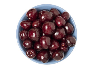 Fresh ripe cherries in bowl. Isolated on white background. Top view.