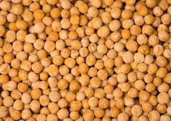 Close up of dry yellow peas background.