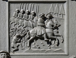 Zwingli riding on the side of the mayor Diethelm Rois to the disputation in Bern, relief on the door of the Grossmunster ("great minster") church in Zurich, Switzerland