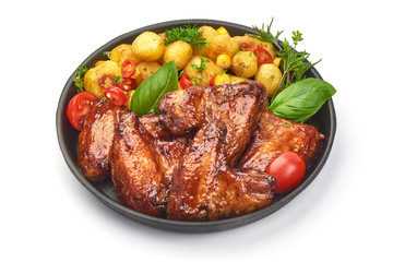 Tasty grilled chicken wings with baked potatoes, Restaurant food, close-up, isolated on white background