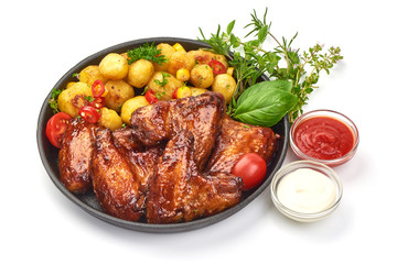 Tasty grilled chicken wings with baked potatoes, Restaurant food, close-up, isolated on white background