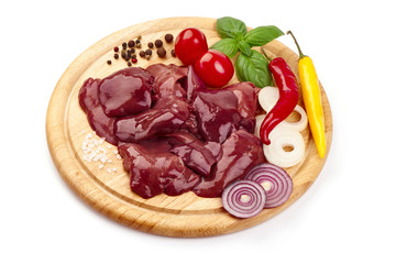 Raw Chicken livers on a cutting board, ingredients for cooking, close-up, isolated on white background