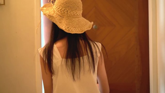 Beautiful woman using keycard open hotel room in travel trip her happiness on summer relaxation.