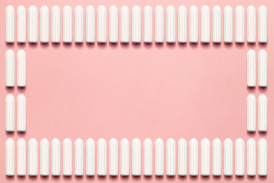 Unpacked tampons rectangle on a soft pink background. Modern female intimate gynecological hygiene. Eco zero waste concept. Copy space place for text. Flat lay